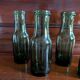 Lot de 5 bouteilles anciennes en verre vert olive
