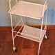 Perforated white metal serving trolley
