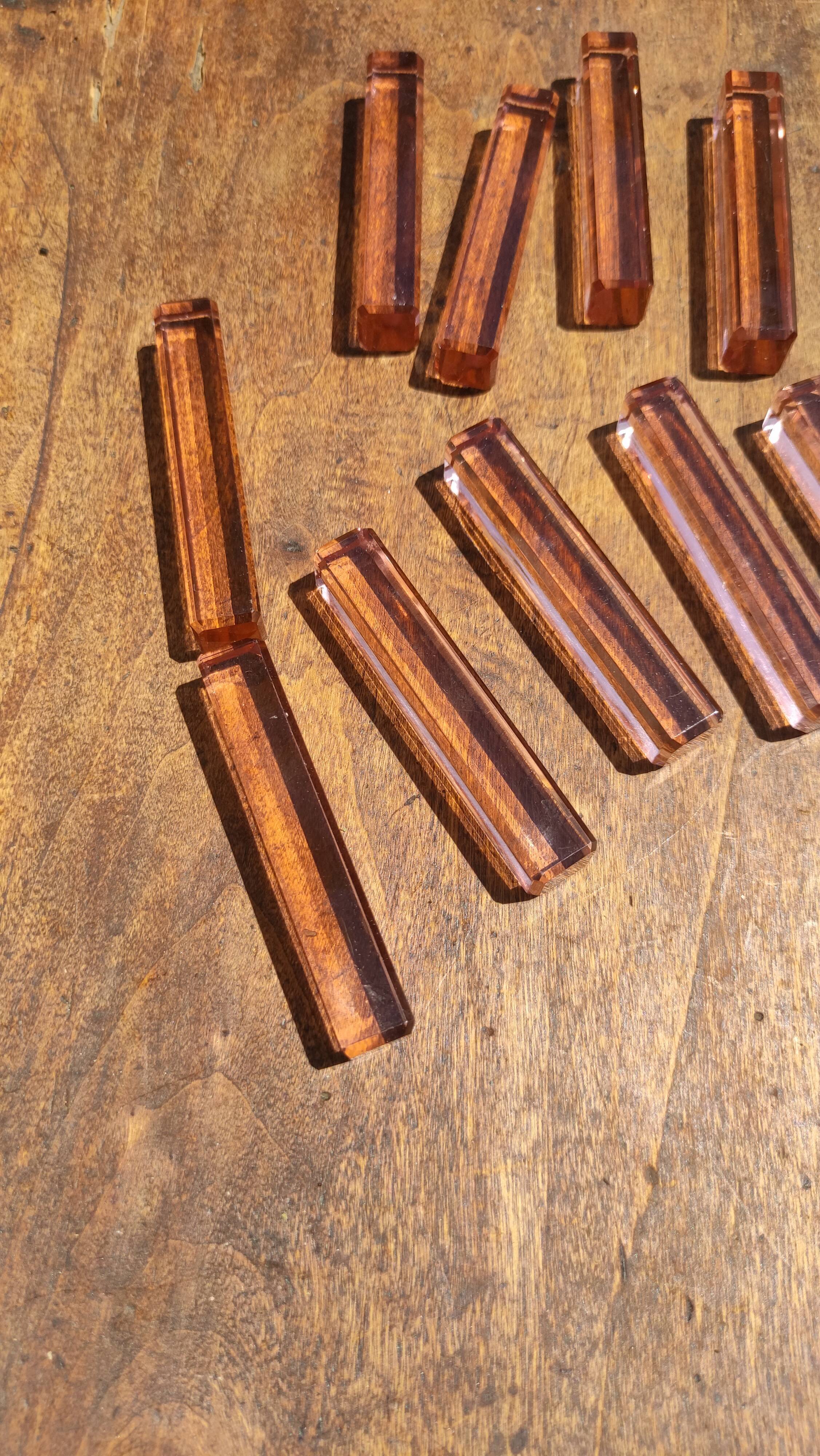 Ten pink glass knife holders