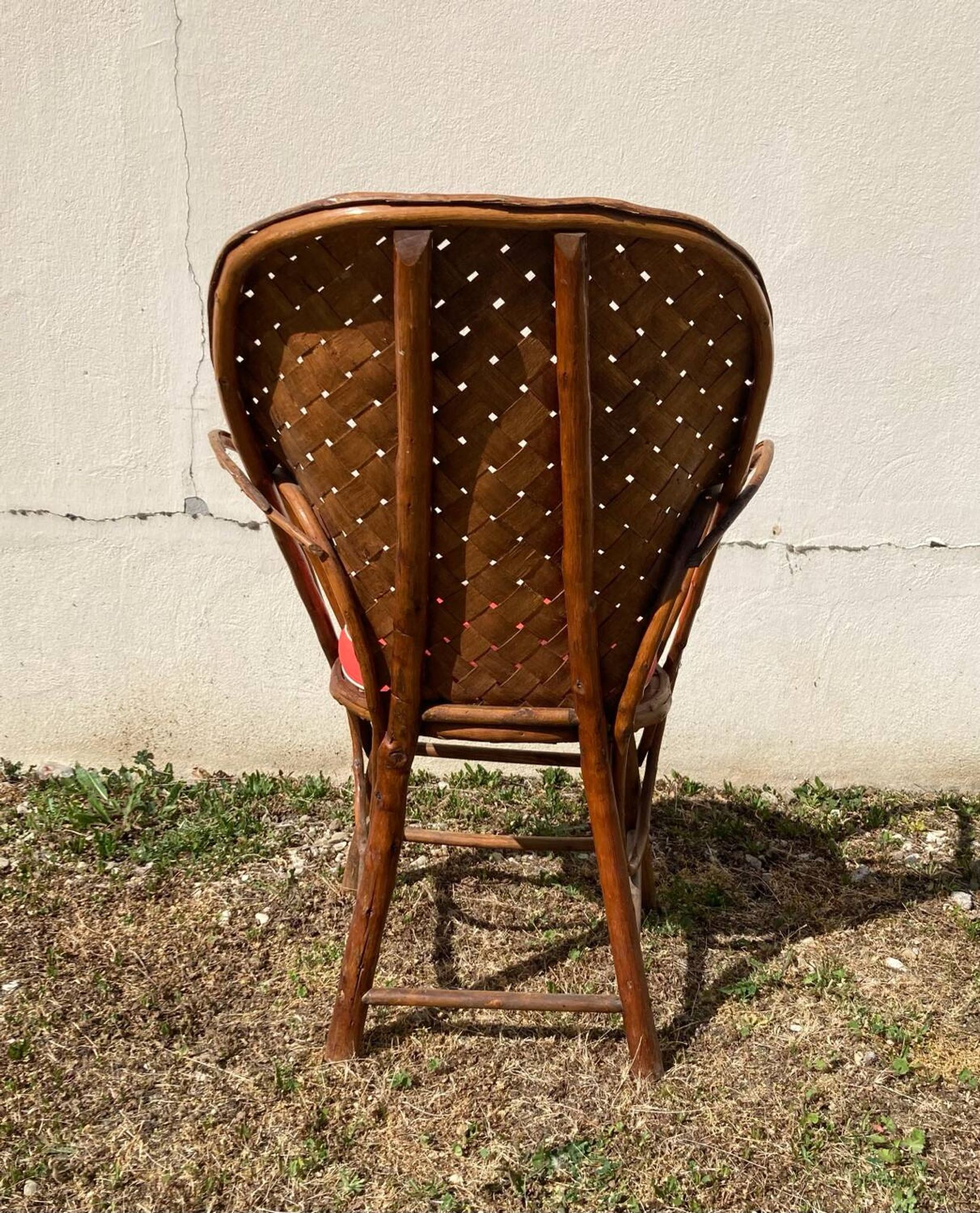 Vintage 1970s armchair in curved woven chestnut + seat cushion