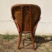 Vintage 1970s armchair in curved woven chestnut + seat cushion