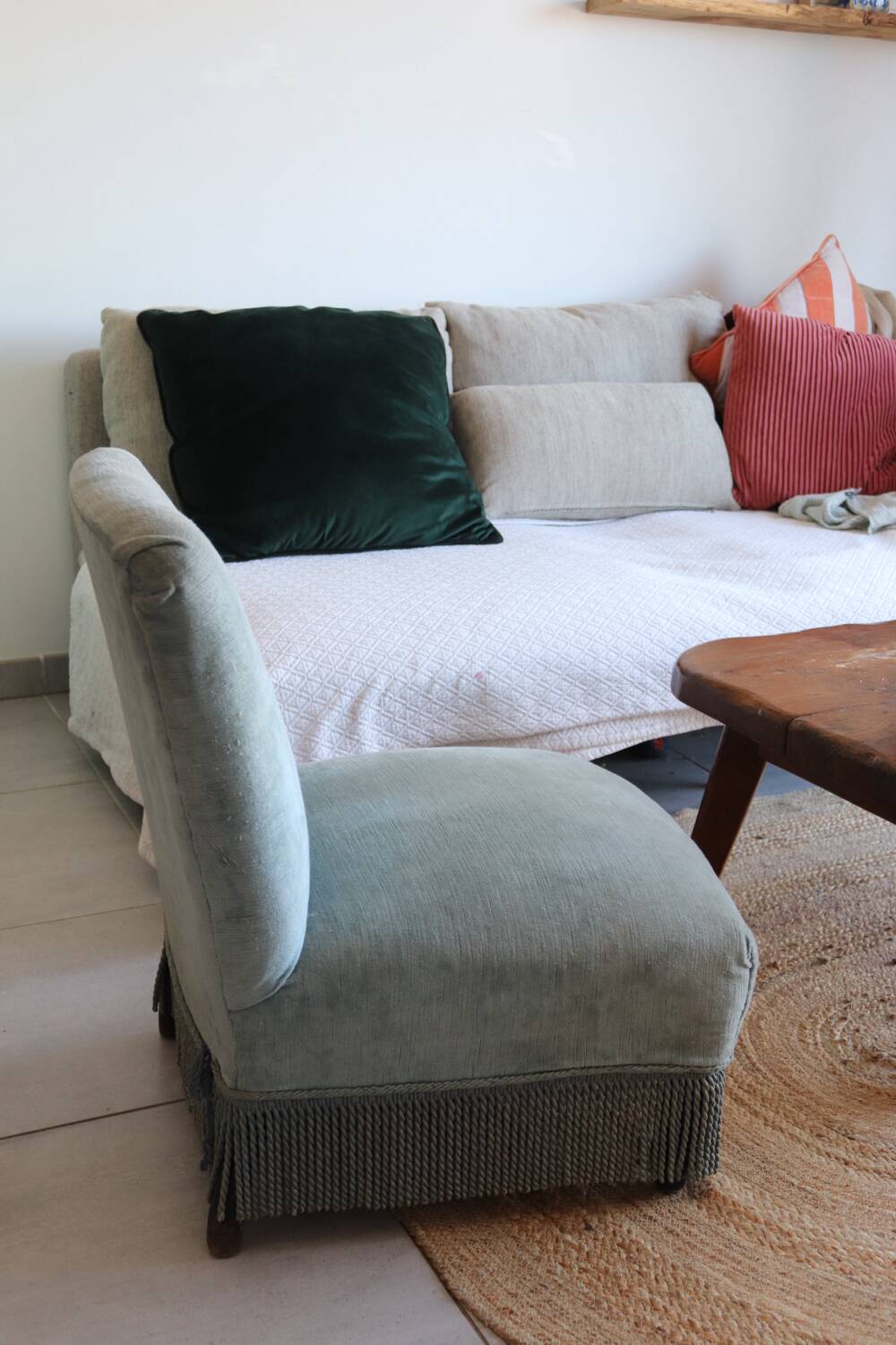 Vintage blue velvet fringed armchair.