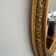 Oval gold mirror in Napoléon III style