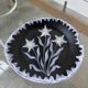 Black ceramic plate from the 60s