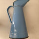 Blue watering can