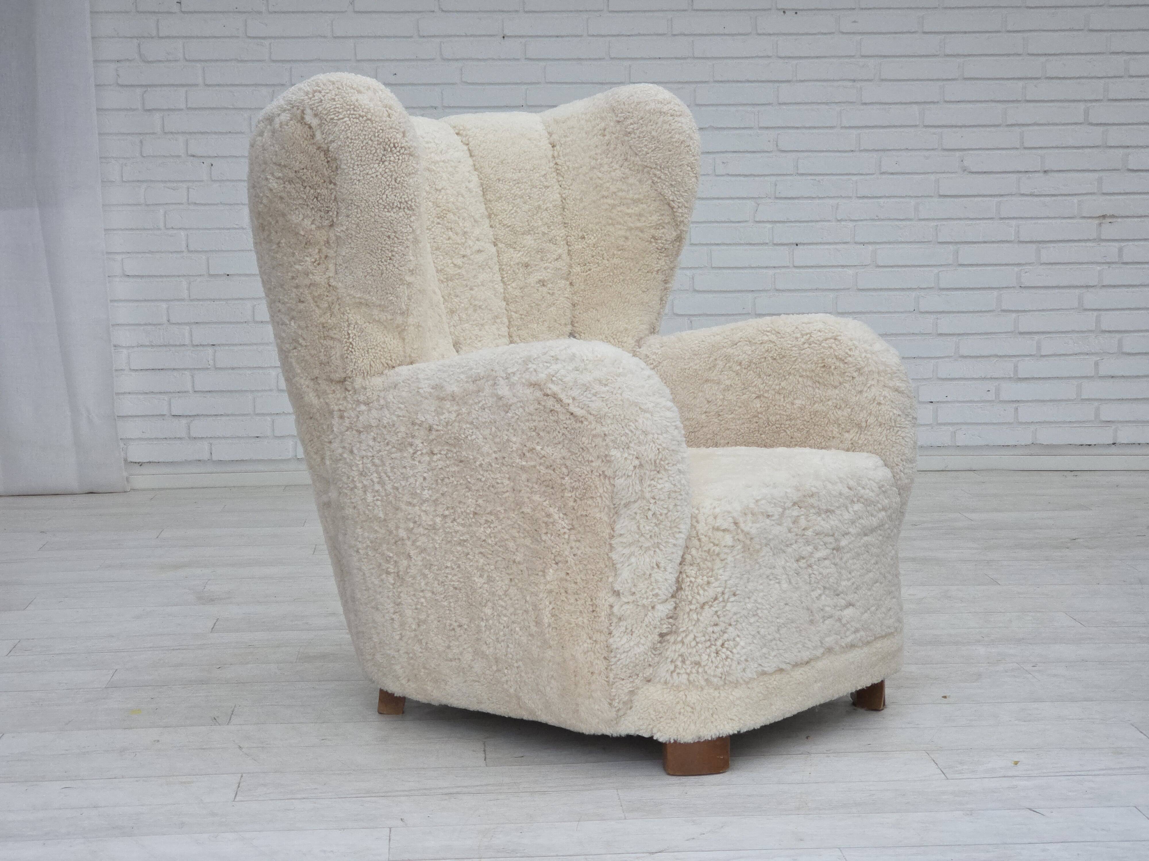 1960s, Danish design, reupholstered highback armchair, genuine sheepskin.