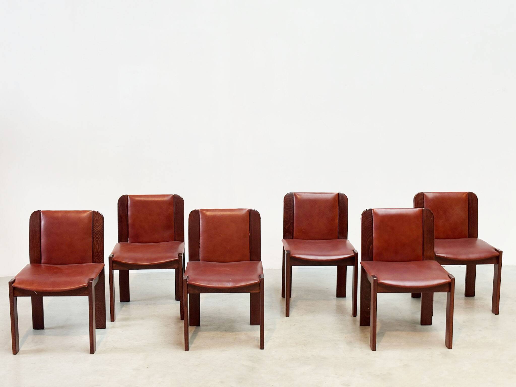 Set of six leather Italian dining chairs