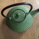 Green cast iron teapot