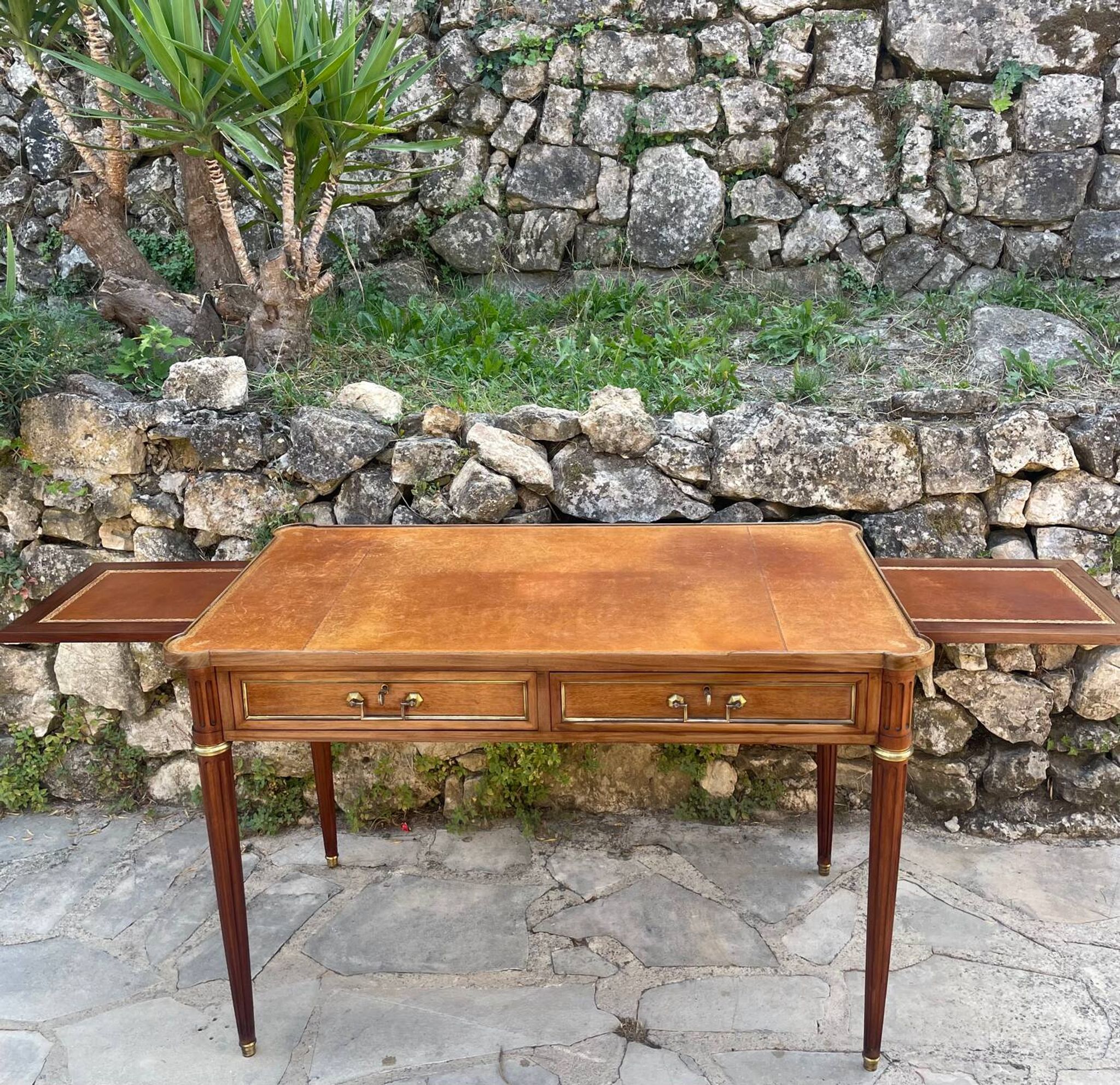 Louis XVI style mahogany flat desk from the late 19th century