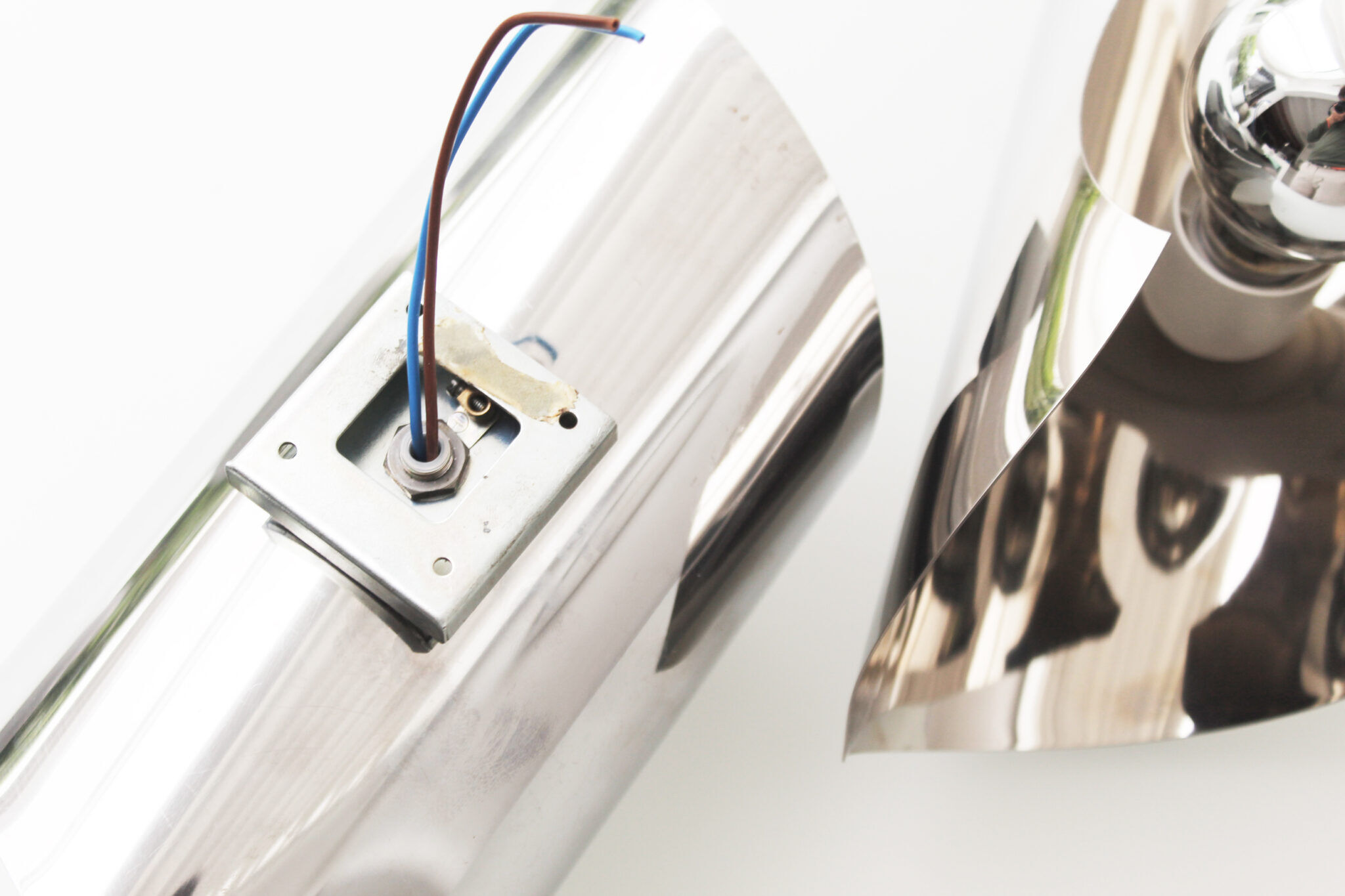 Vintage pair of 1970's chrome space age wall lights