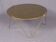 Circular coffee table in gilded eglomisé glass and brass, Italy 1960s.