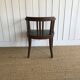 Office chair in oak and green faux leather.