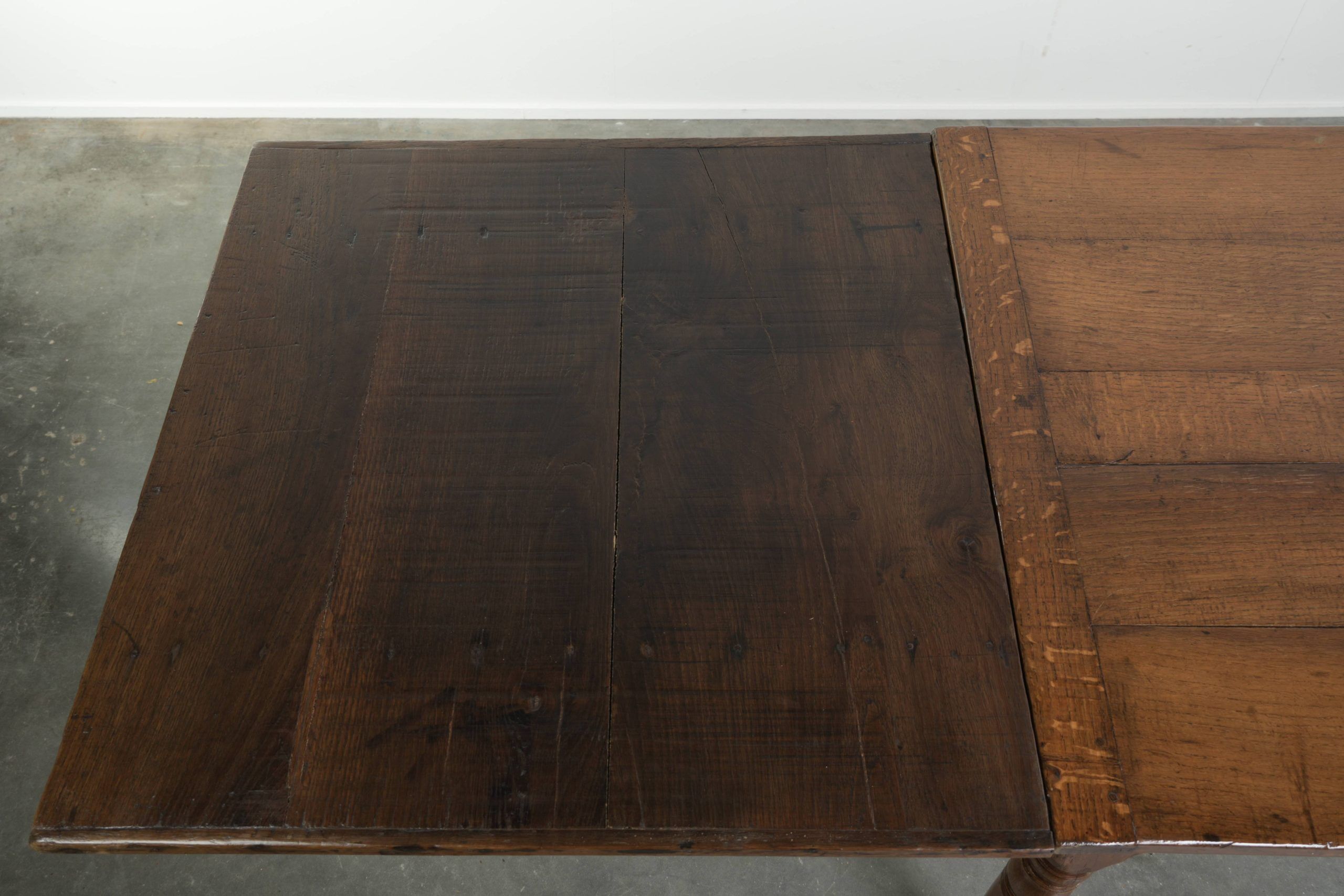 Antique oak dining table from the late 18th century with extendable leaves