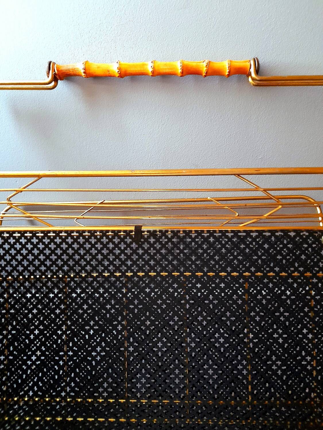 Perforated metal magazine rack 1950