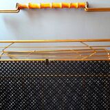 Perforated metal magazine rack 1950