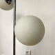 Vintage floor lamp has two opaque glass spheres