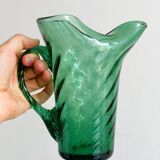 Green blown glass pitcher, unique twisted design
