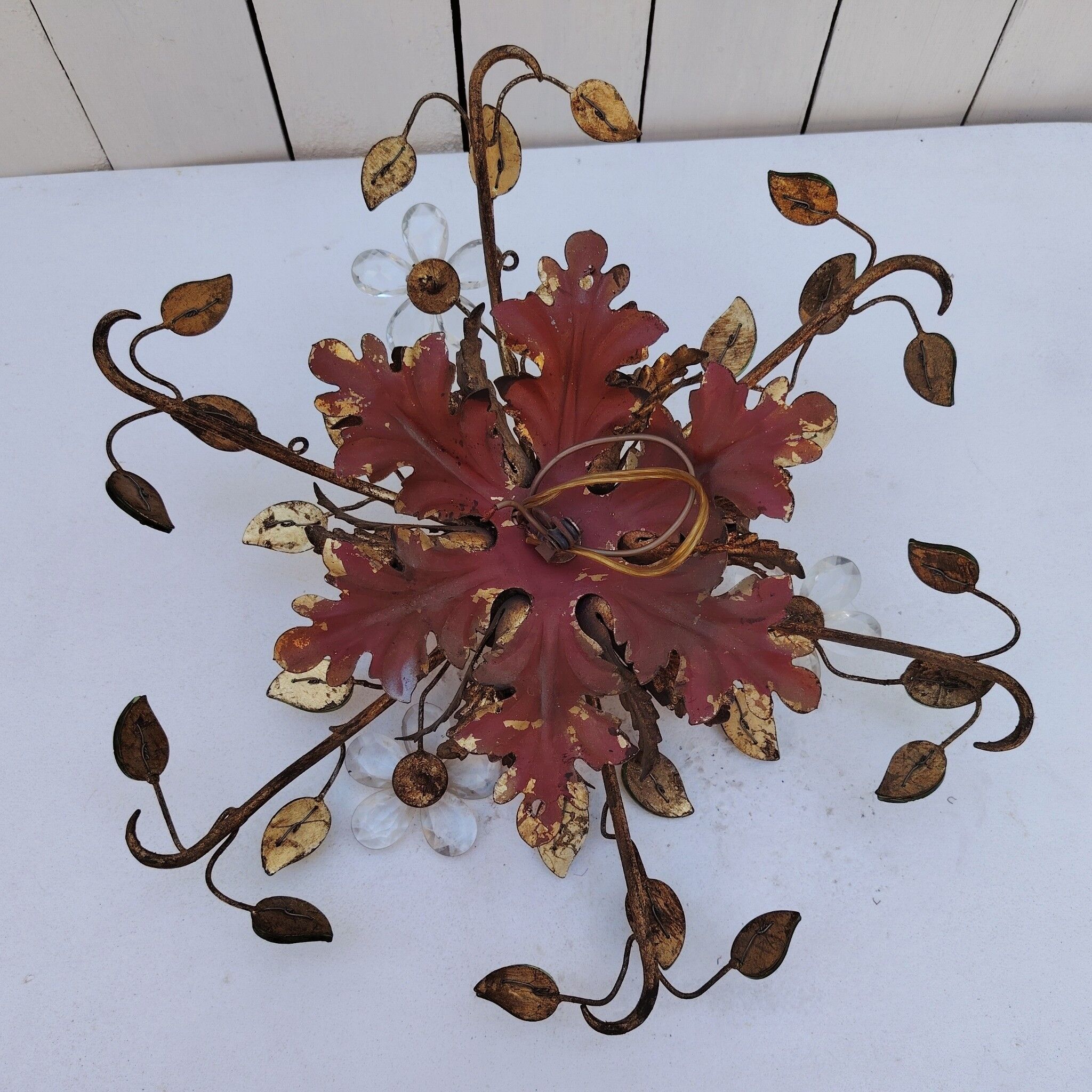 Flower wall light, gilded metal and glass cabochons, attributed to Baguès.