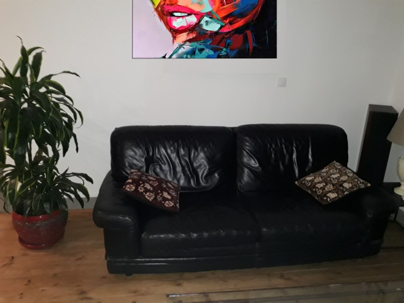 Natuzzi black leather sofa