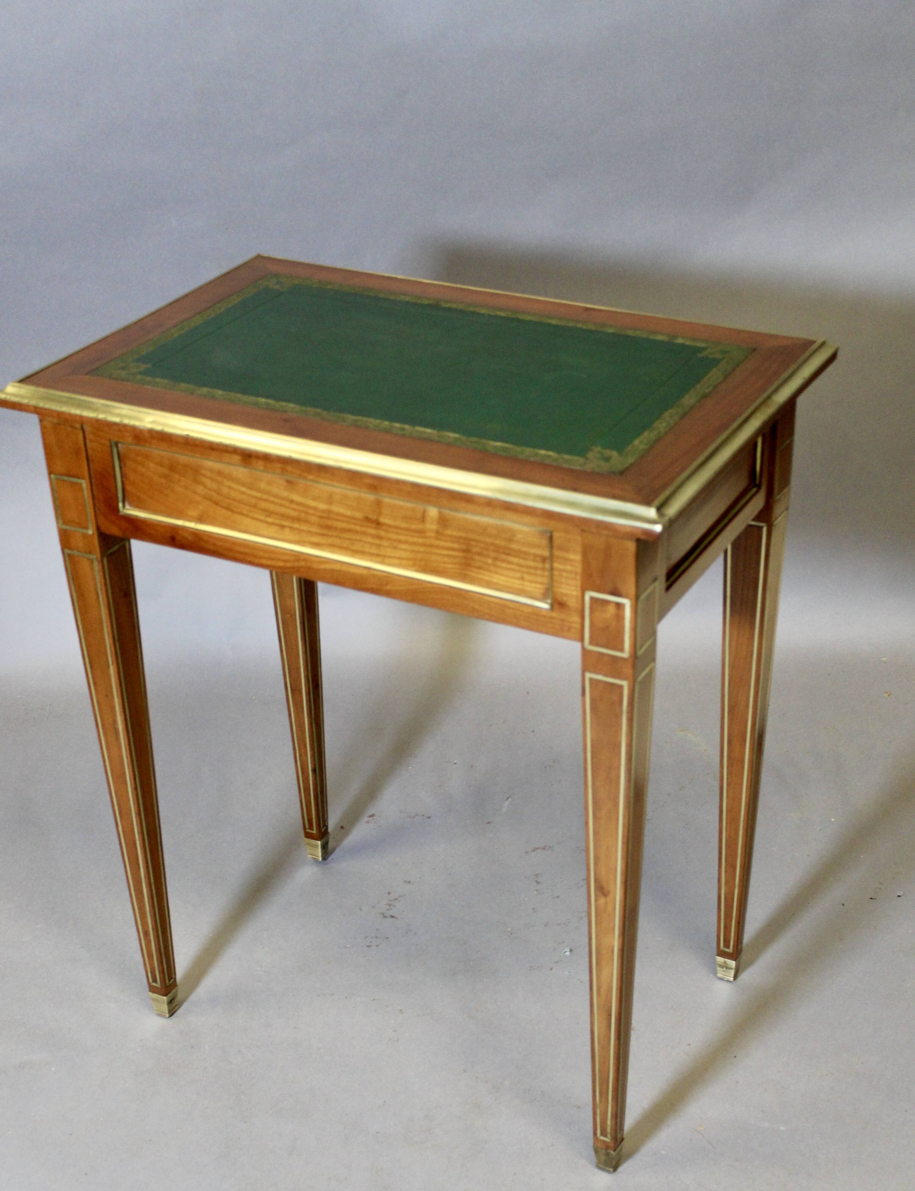 Louis XVI writing table with brass beading