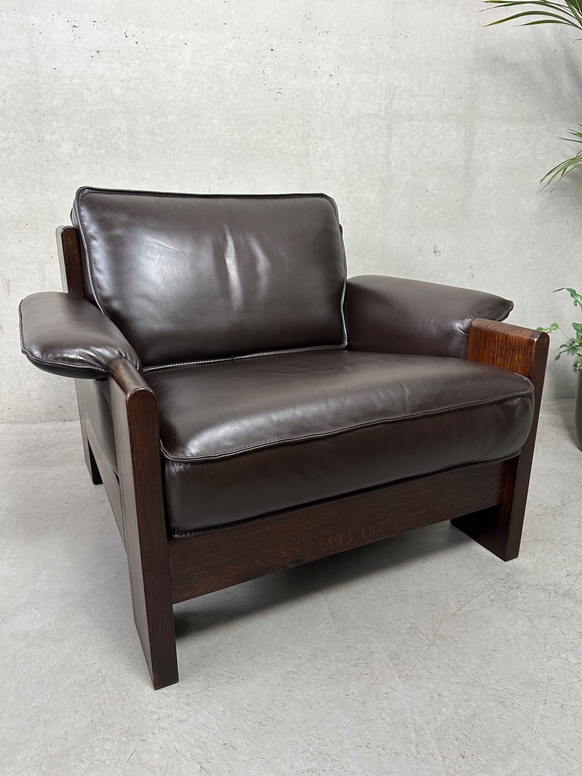 Vintage Leolux brown leather/oak lounge chair and ottoman by Harry de Groot – 1970