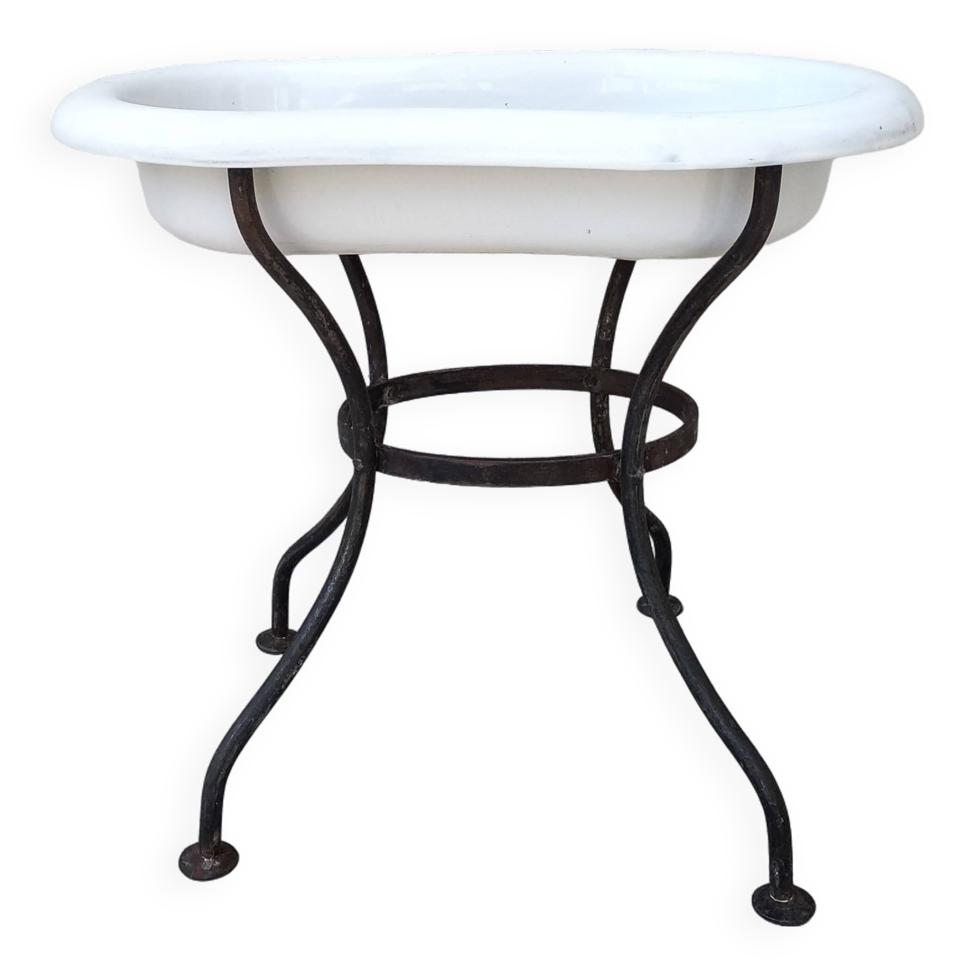 Antique bidet in enamelled sheet metal with wrought iron support
