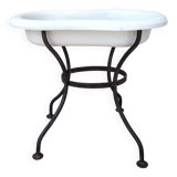 Antique bidet in enamelled sheet metal with wrought iron support