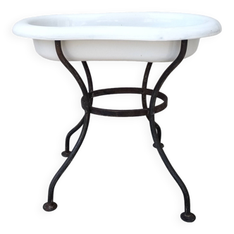 Antique bidet in enamelled sheet metal with wrought iron support