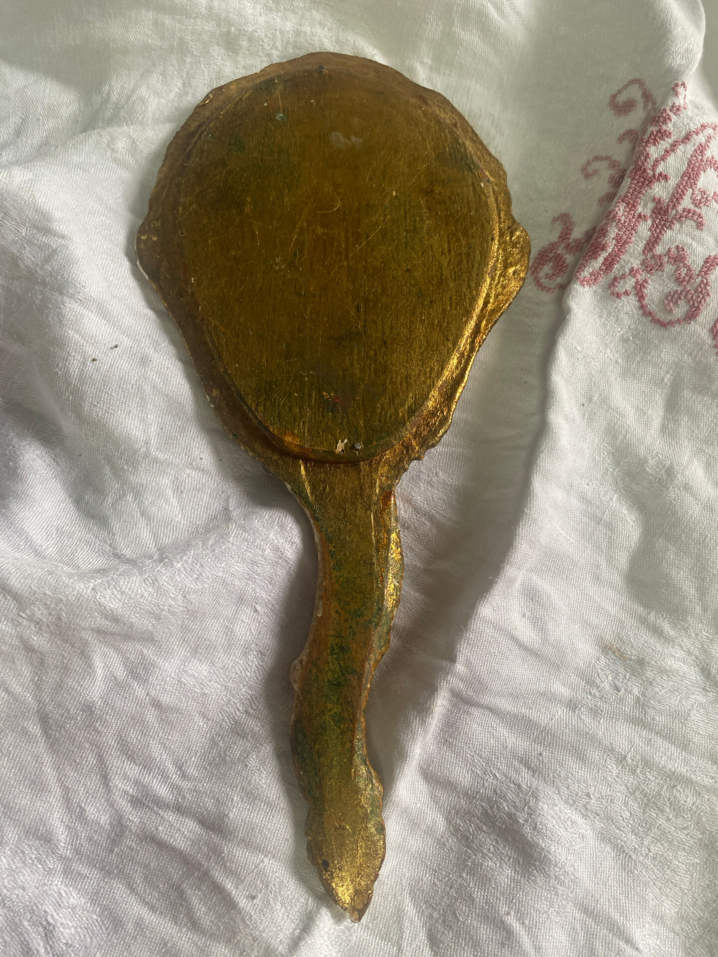Patinated wooden Florentine hand mirror