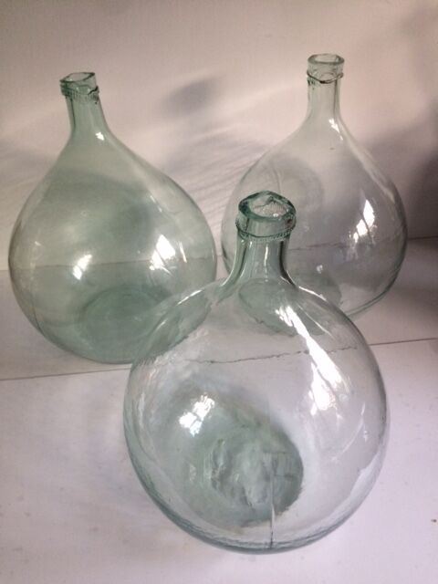 Transparent old demijohn about 8 to 10 L