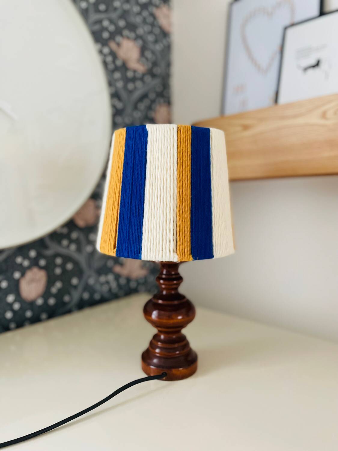 Vintage lamp with turned wooden base, striped wool lampshade