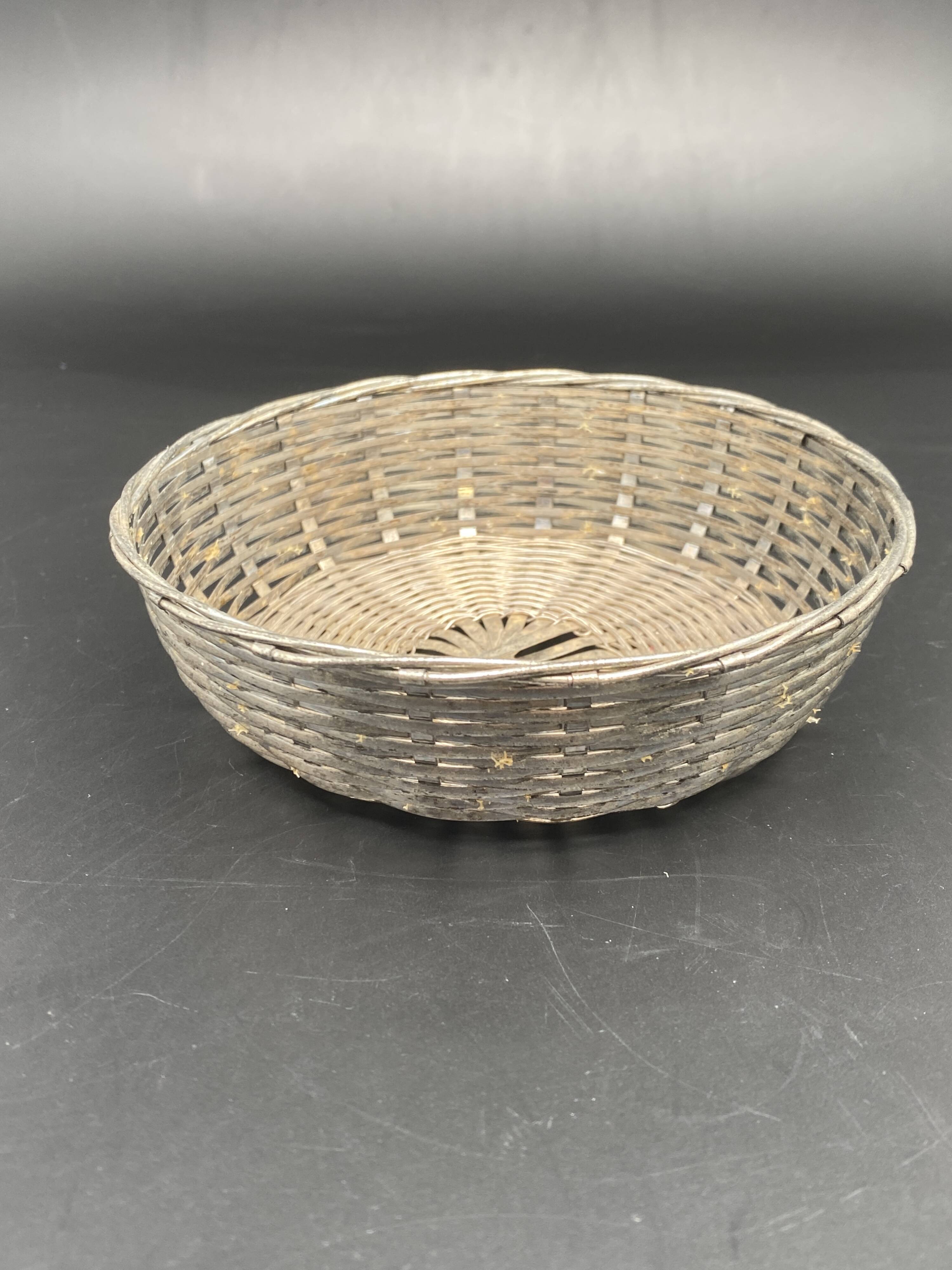 Glass flower stand with woven metal support