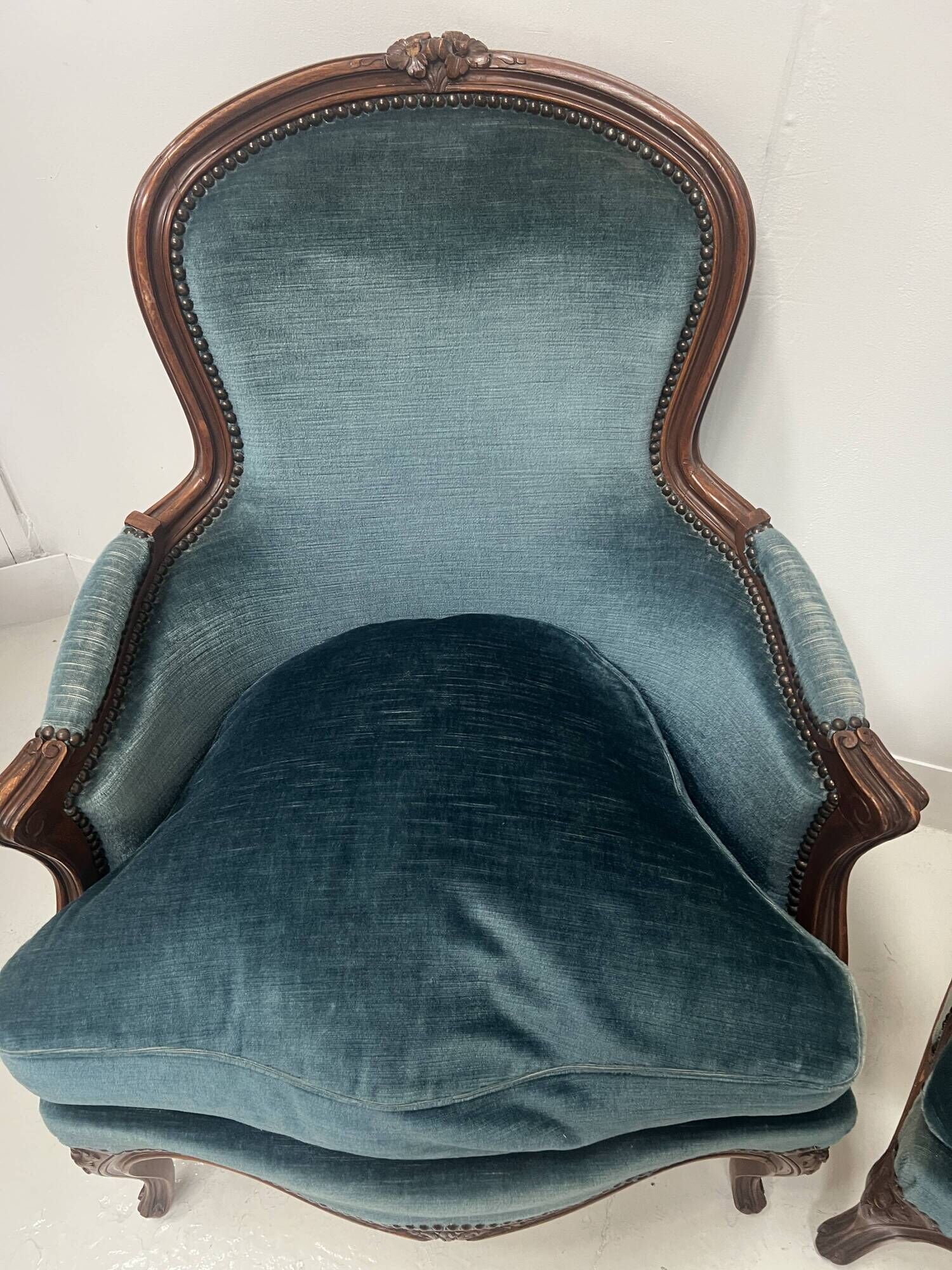 Pair of Louis XV style armchairs in natural wood, 20th century.