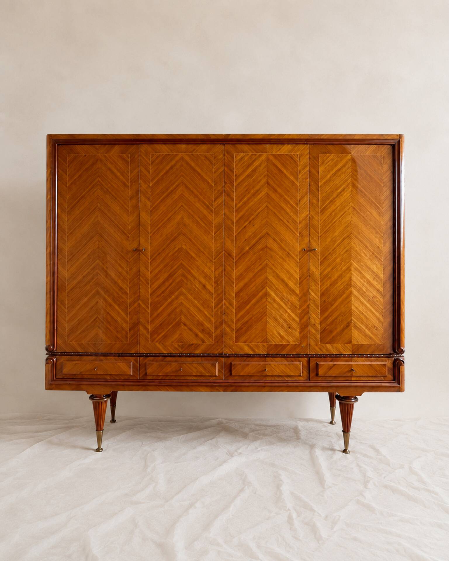 Vintage 4-door chevron wood wardrobe with mirror and gold legs.