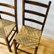 Paire de chaises rustiques en bois et assises paillées