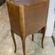 A bedside table with a drawer and a niche in Louis XV style.