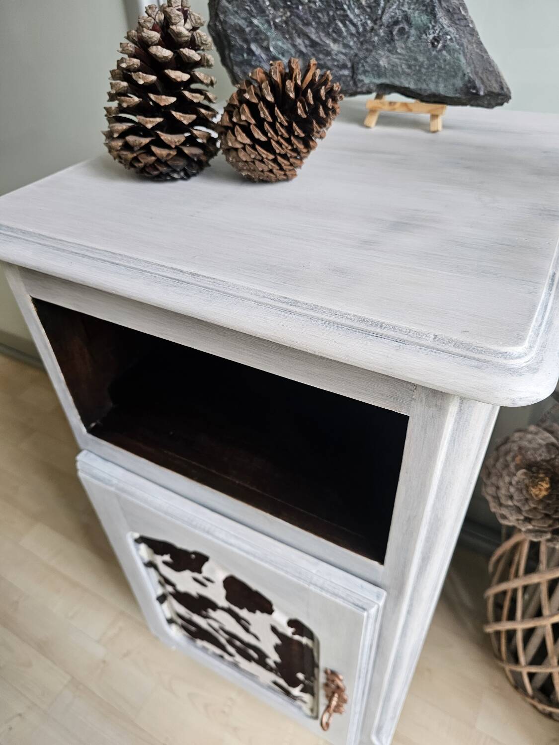 Two solid wood bedside tables with calfskin decoration.