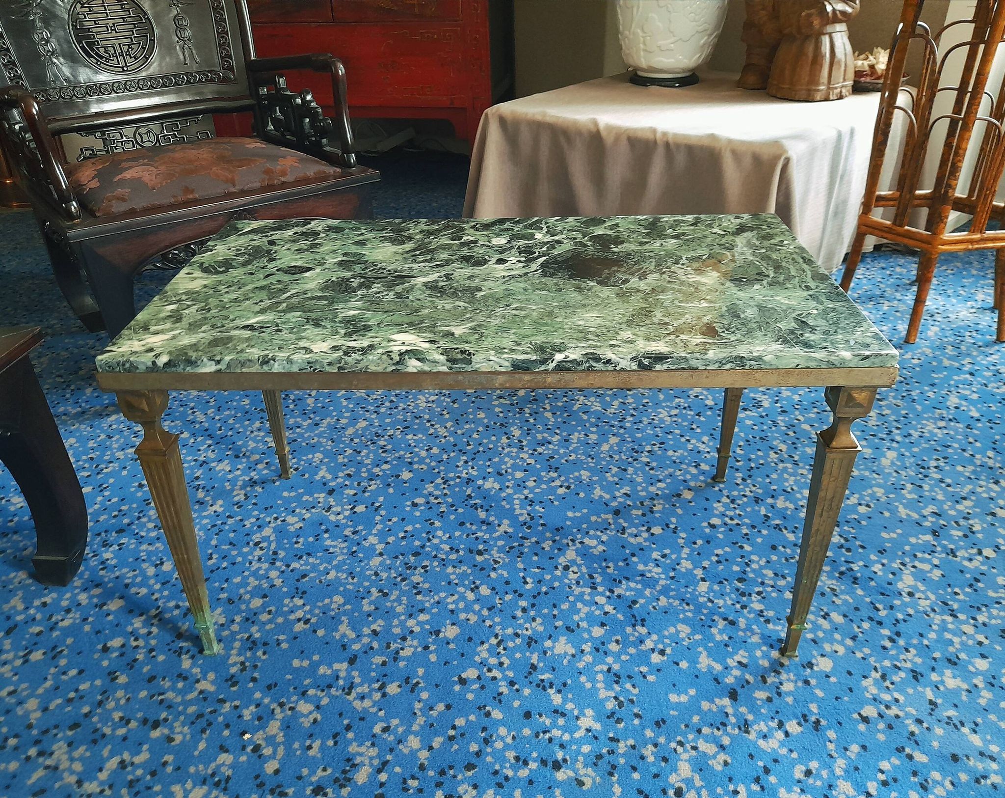 Coffee table in gilded bronze and green Alpine marble