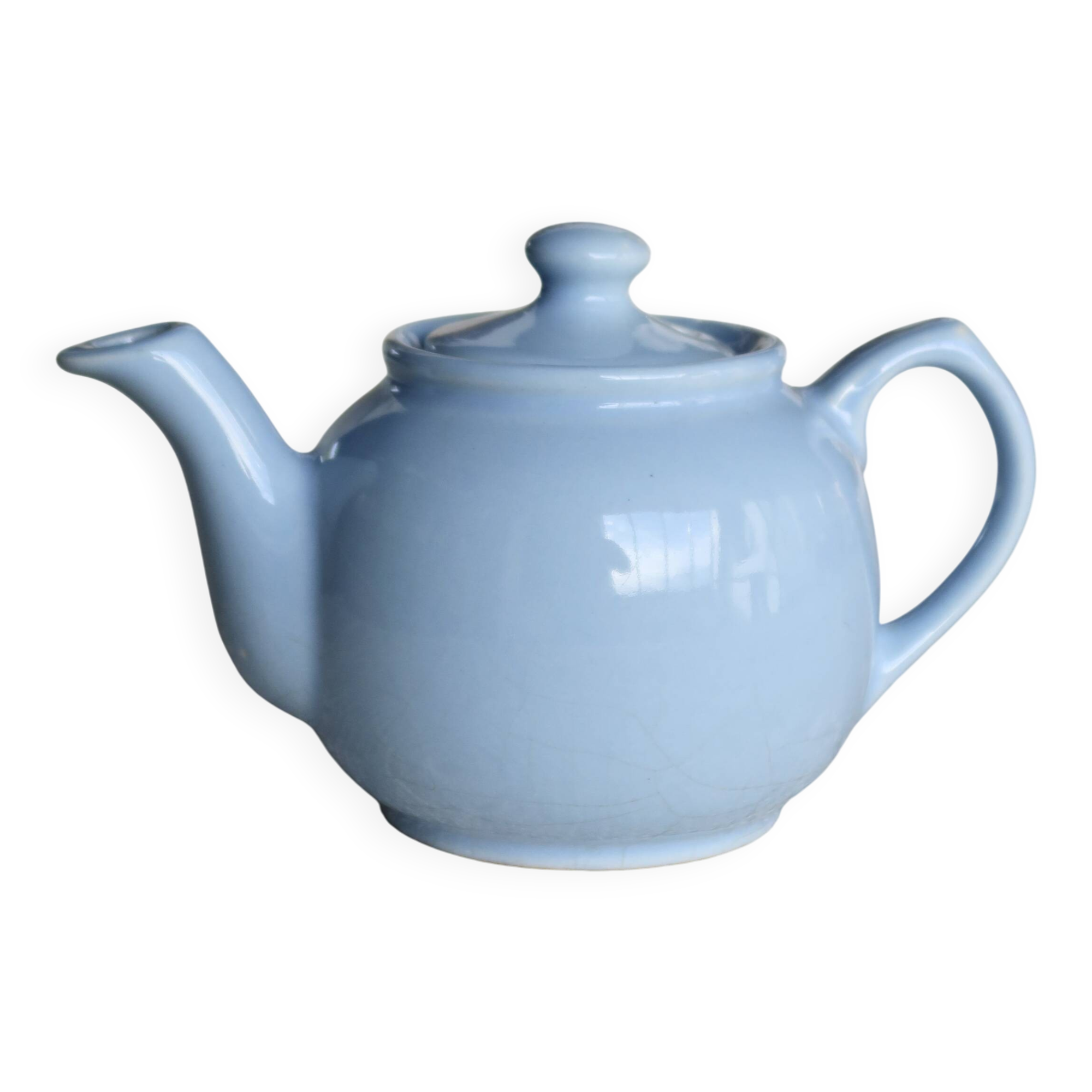 Small vintage sky-blue earthenware teapot