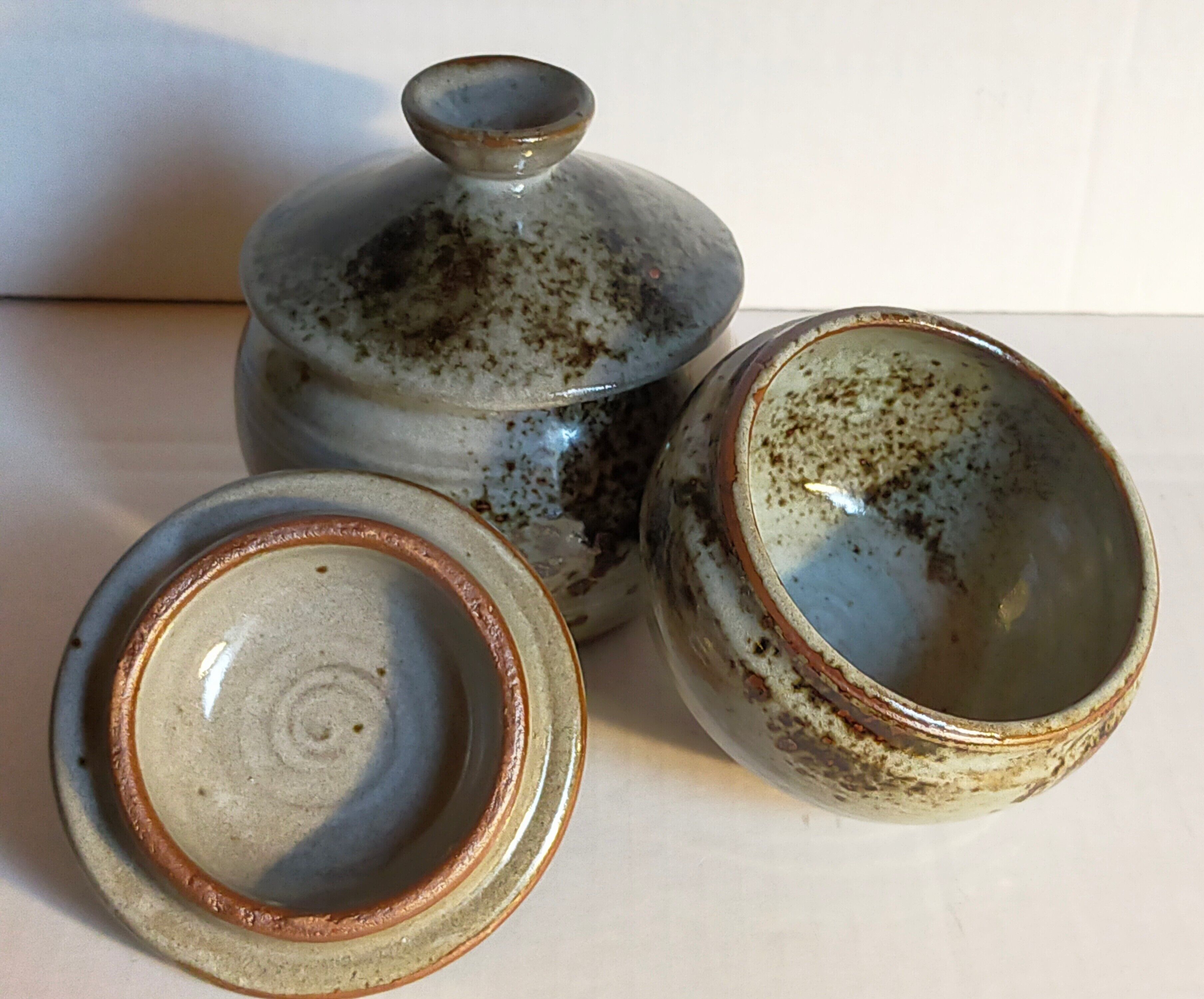 Duo of potter's pots covered in vintage glazed stoneware