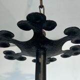 Lustre with 12 lights in wrought iron decorated with clovers and foliage.