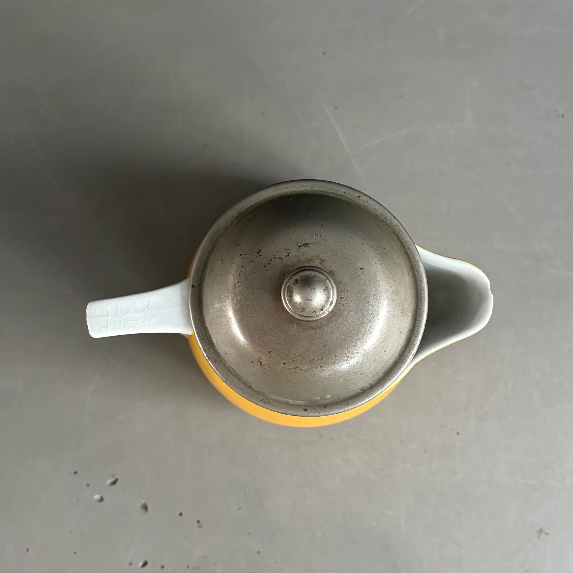 Antique teapot in earthenware with a tin filter lid.