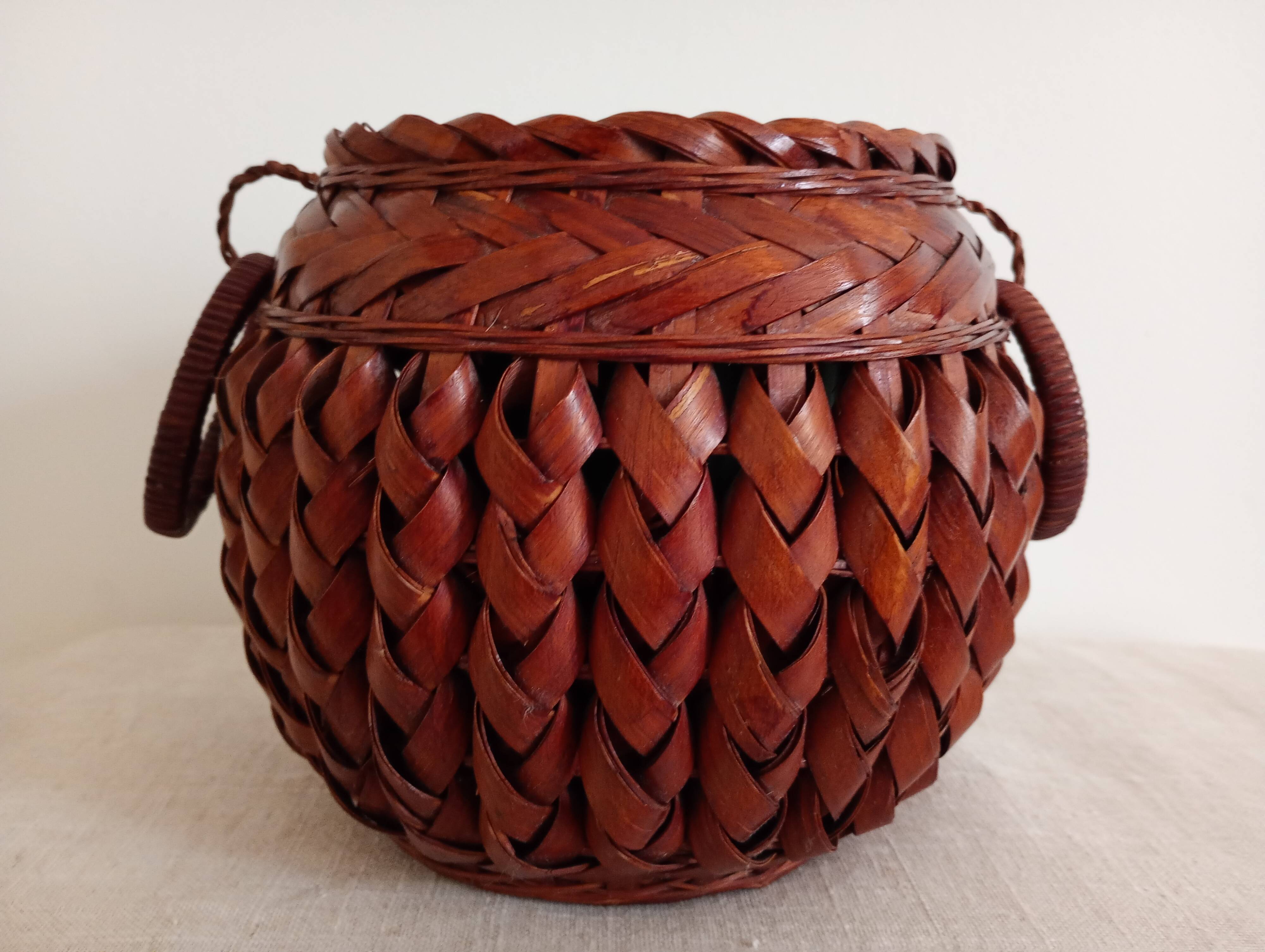 Japanese vase made of woven bamboo. Ikebana.