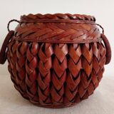 Japanese vase made of woven bamboo. Ikebana.