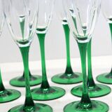 8 large green stem champagne flutes in very good condition.