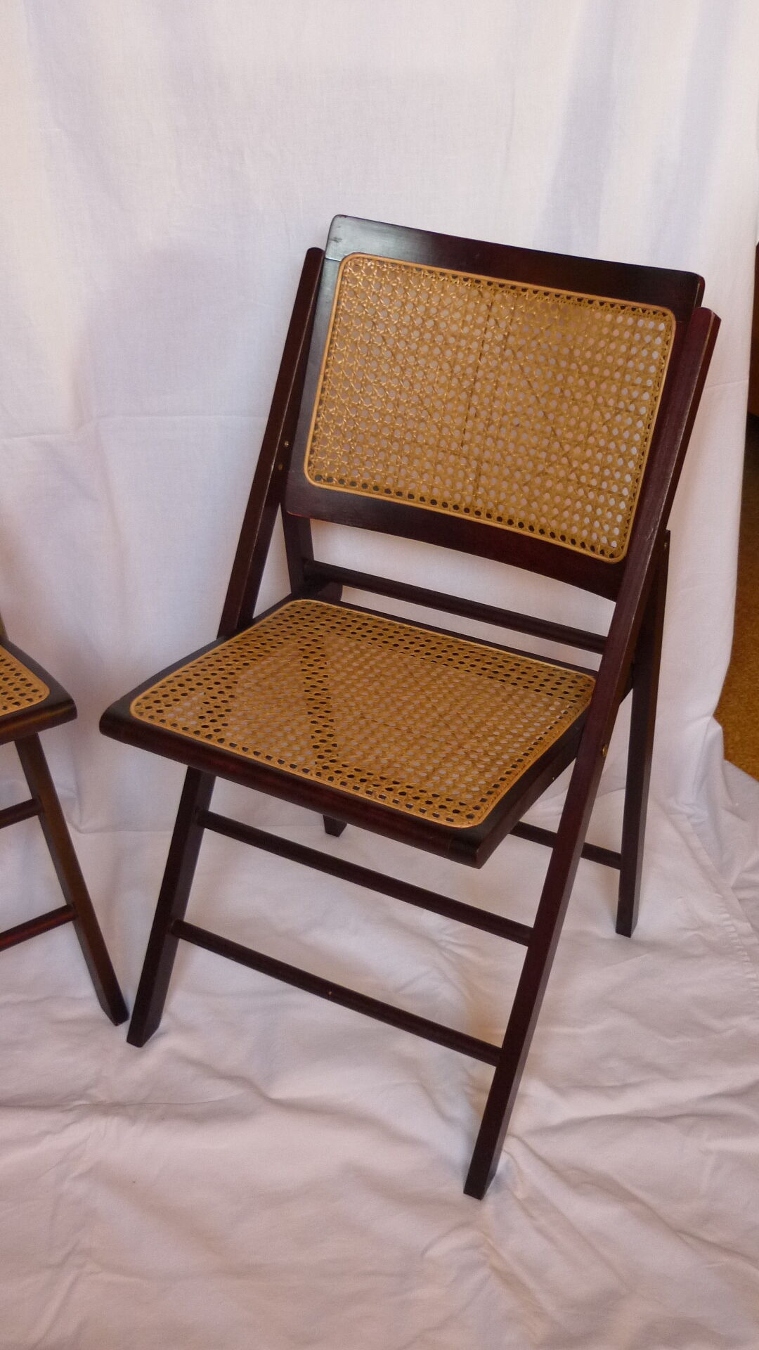 Duo of canned folding chairs