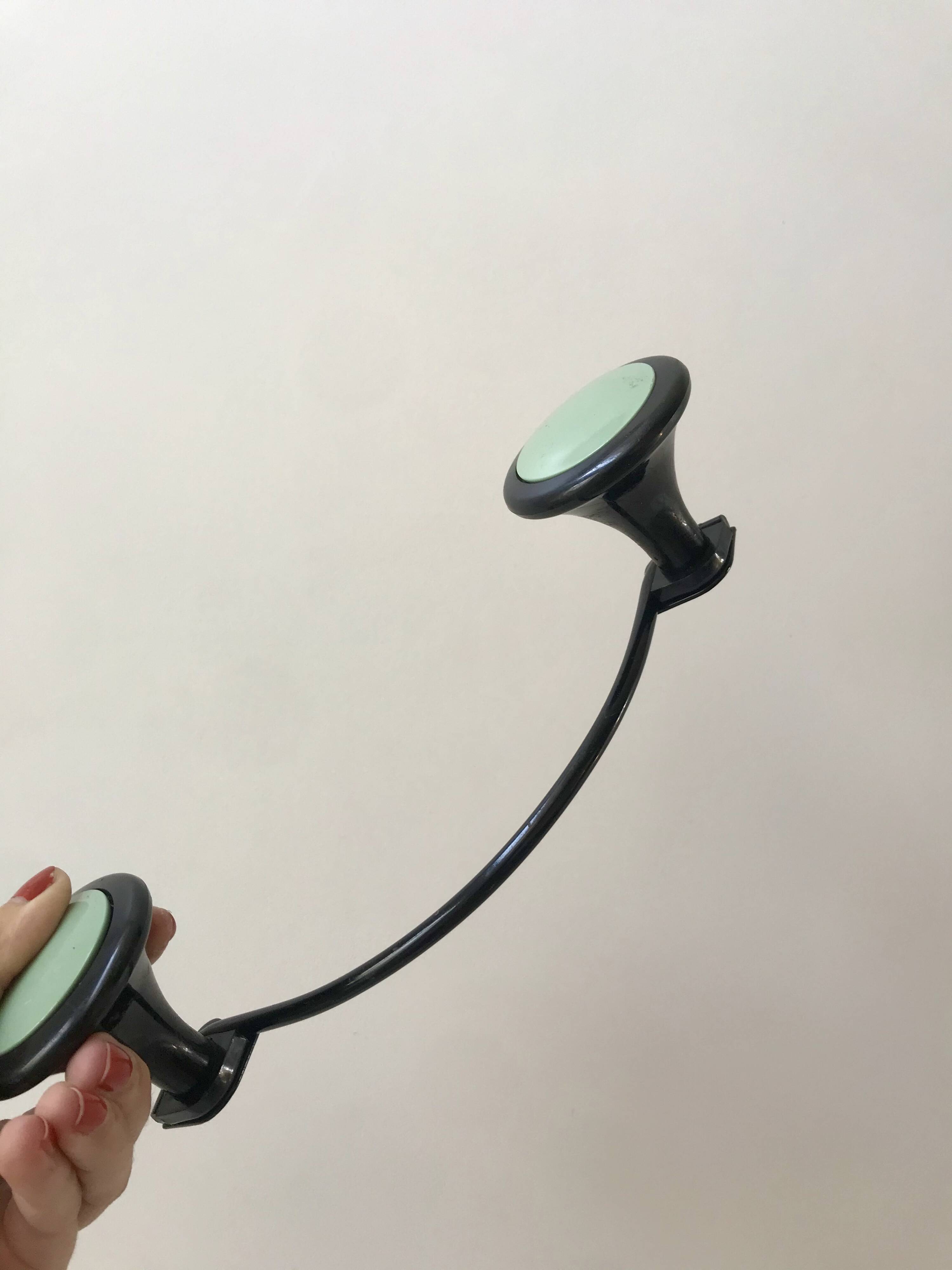 Design coat hook in sage green and black metal from the 70s