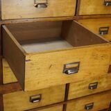 School cabinet bank of vintage Dutch drawers in mid-twentieth century pine