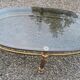 Oval coffee table in gilded brass and smoked glass 1970
