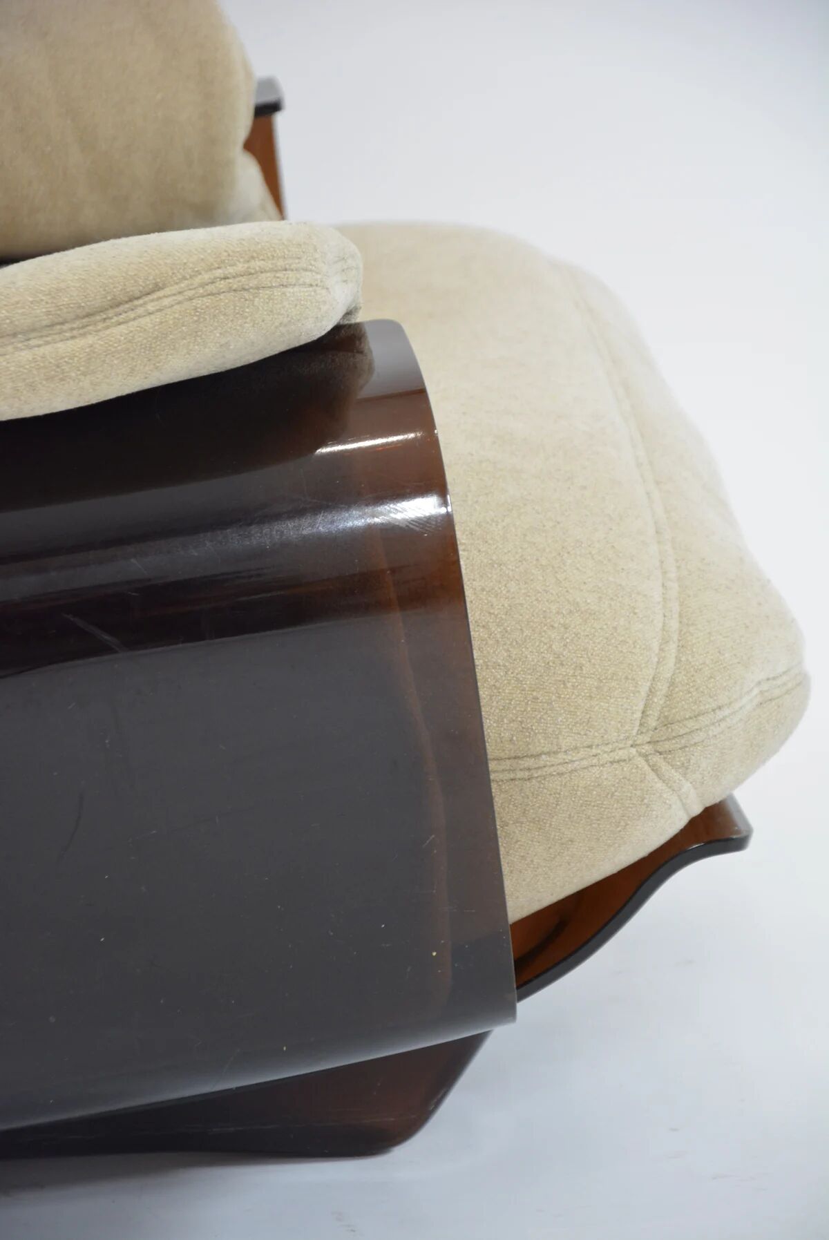 Marsala armchair and its light beige Ligne Roset footrest.